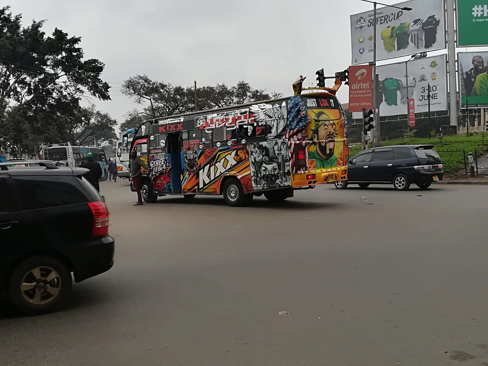 Colourful matatu minibus crossing a busy intersection in Nairobi, Kenya